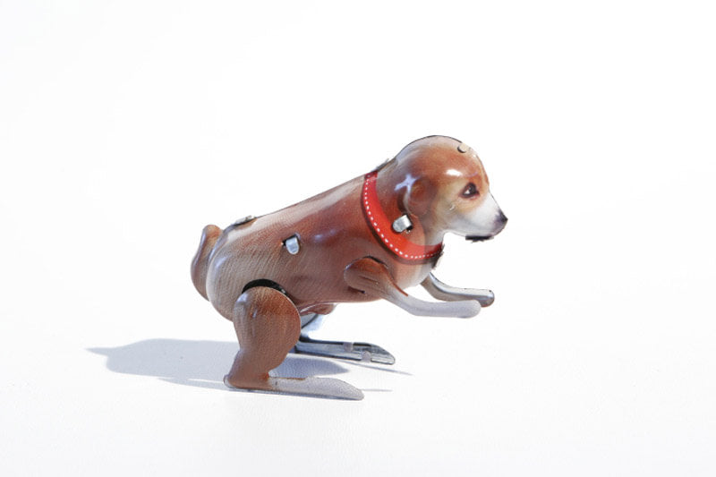 Brown Jumping dog tin toy 