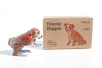 Jumping dog tin toy  with Tommy hopper text on packaging 