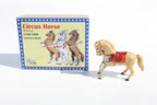 jumping horse tin toy next to its packaging