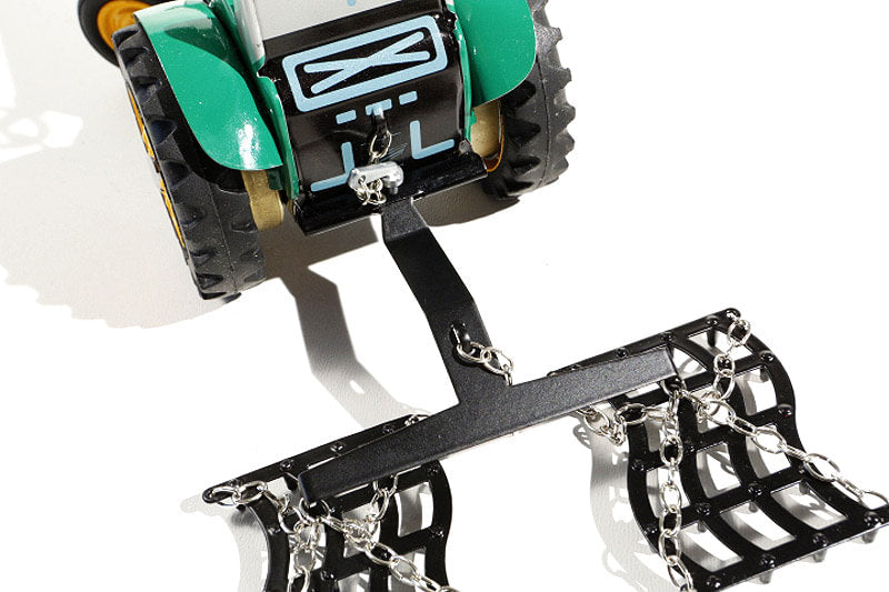 Close up of Kovap Harrow tin toy