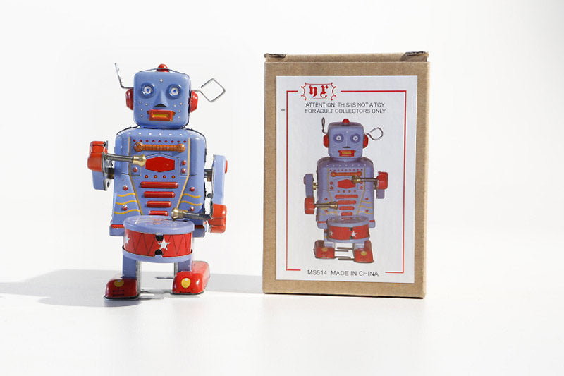 Little Drumming Vintage-style robot tin toy with blue and red colours with packaging