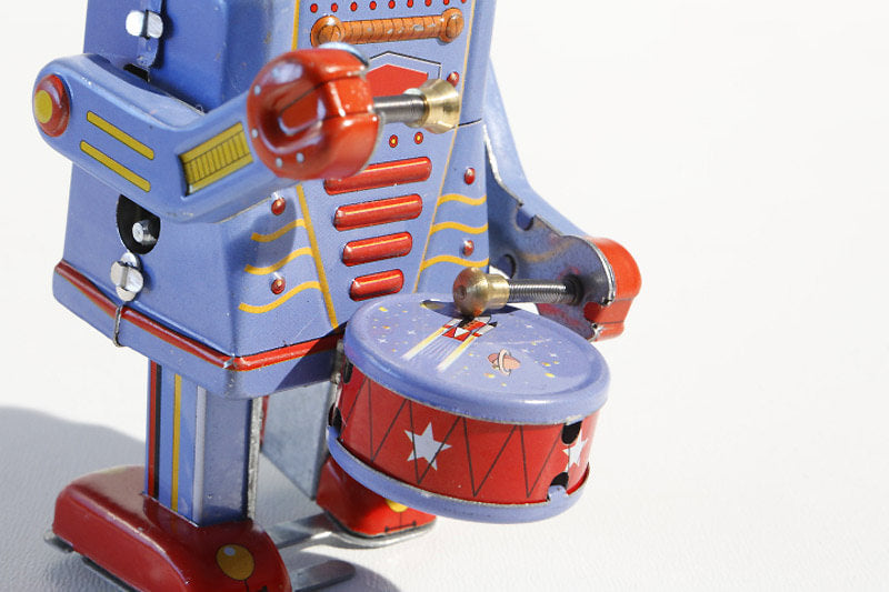 Little Drumming Vintage-style robot tin toy with blue and red colours 