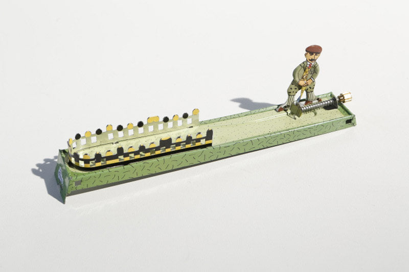 Little golfer tin toy
