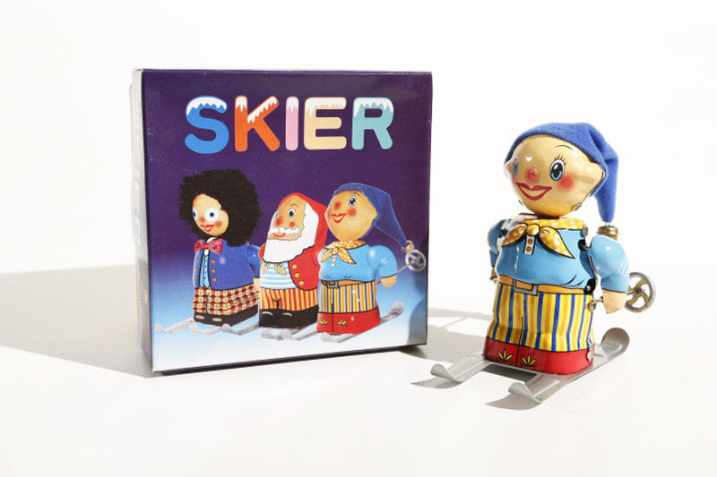Little Skier tin toy with colourful packaging