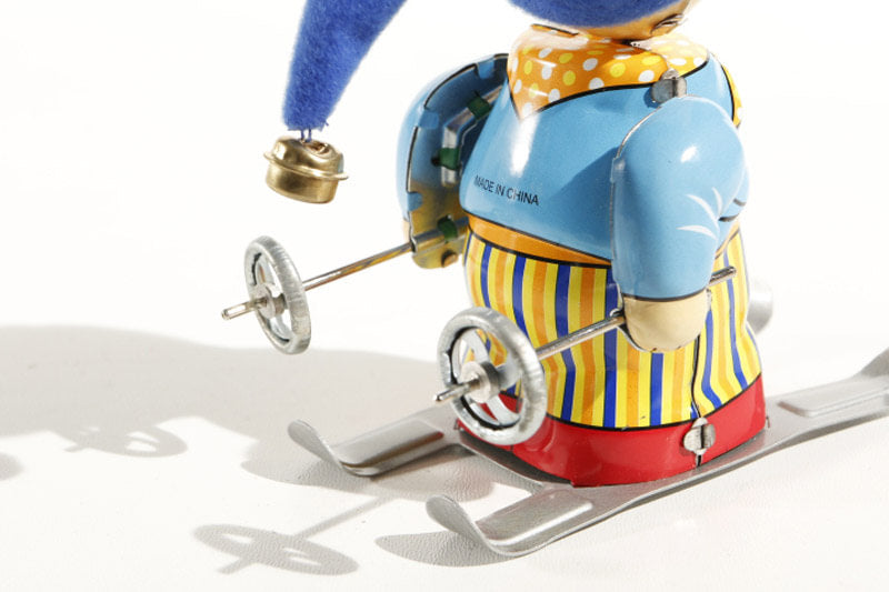 Close up of Little Skier tin toy