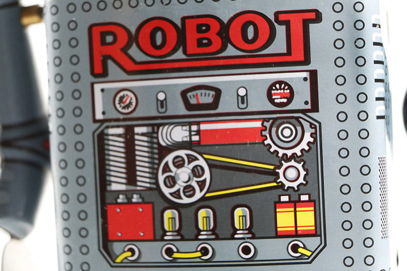 Mechanical Tin Toy robot  with red 'ROBOT' text and mechanical design