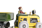 Close up of Mini tractor and trailer tin toy