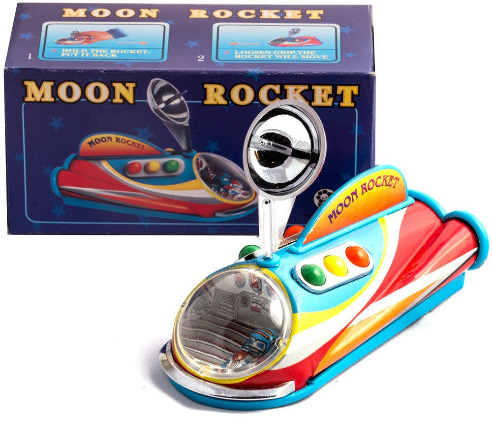 Colourful tin toy moon rocket with packaging i