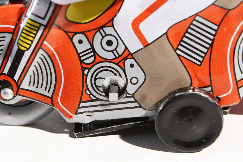 Close up of motorcycle with sidecar tin toy