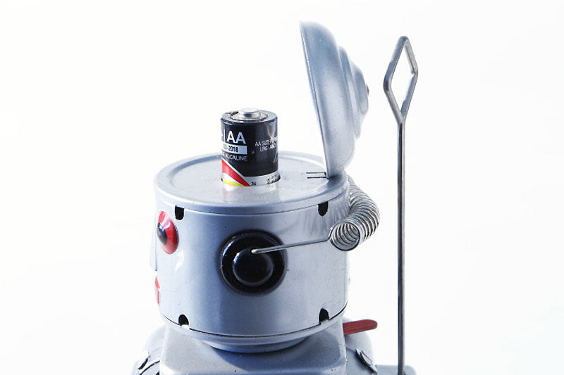 Close up of Mr Silver robot tin toy  head with AA battery