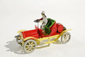 Ol Timer vintage car tin toy with red body and yellow chassis