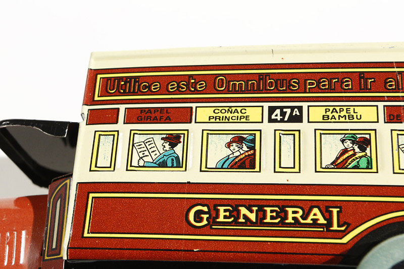 Close up of omnibus tin toy with passengers