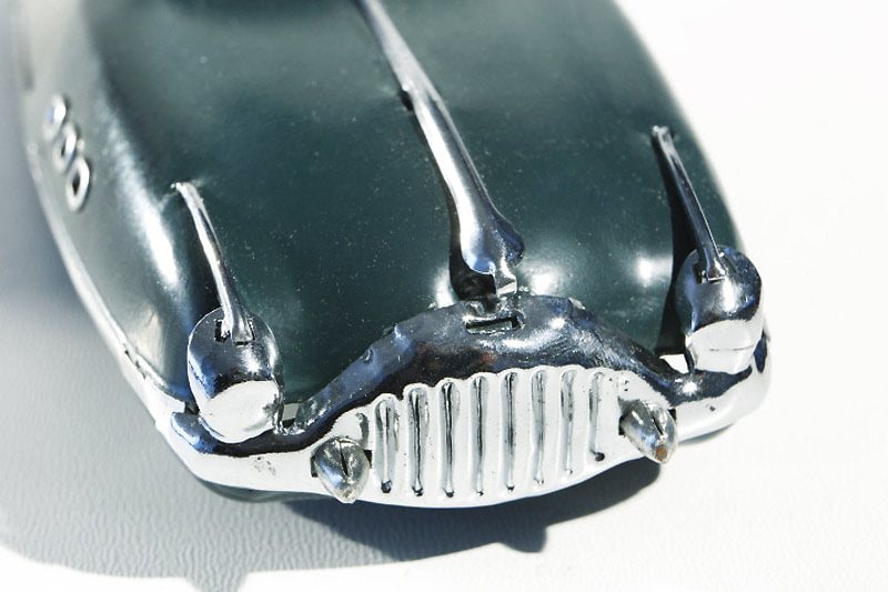 Close up of packard tin toy car