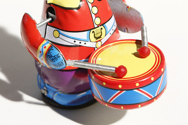 Close up of colourful panda drummer tin toy