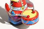 Close up of colourful panda drummer tin toy