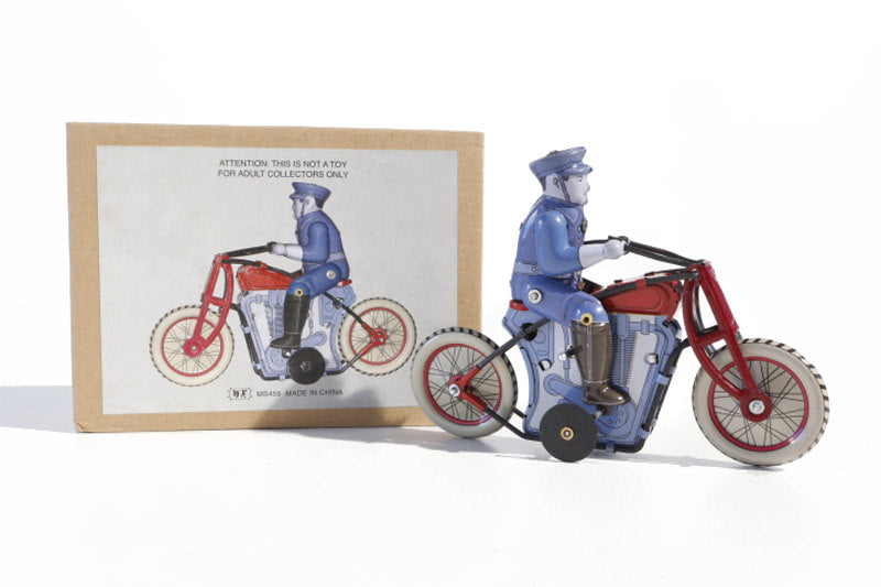 Policeman on Bike tin toy with packaging