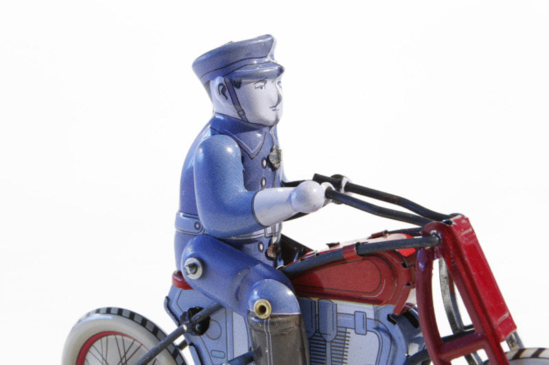 Close up of Policeman on Bike tin toy