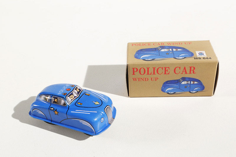 Blue police car tin toy with packaging