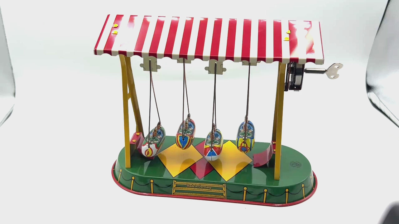 Large Swing Rockets fairground tin toy
