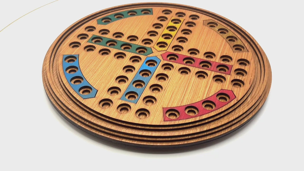 Round Ludo wooden board game with marble pieces