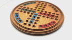 Round Ludo wooden board game with marble pieces
