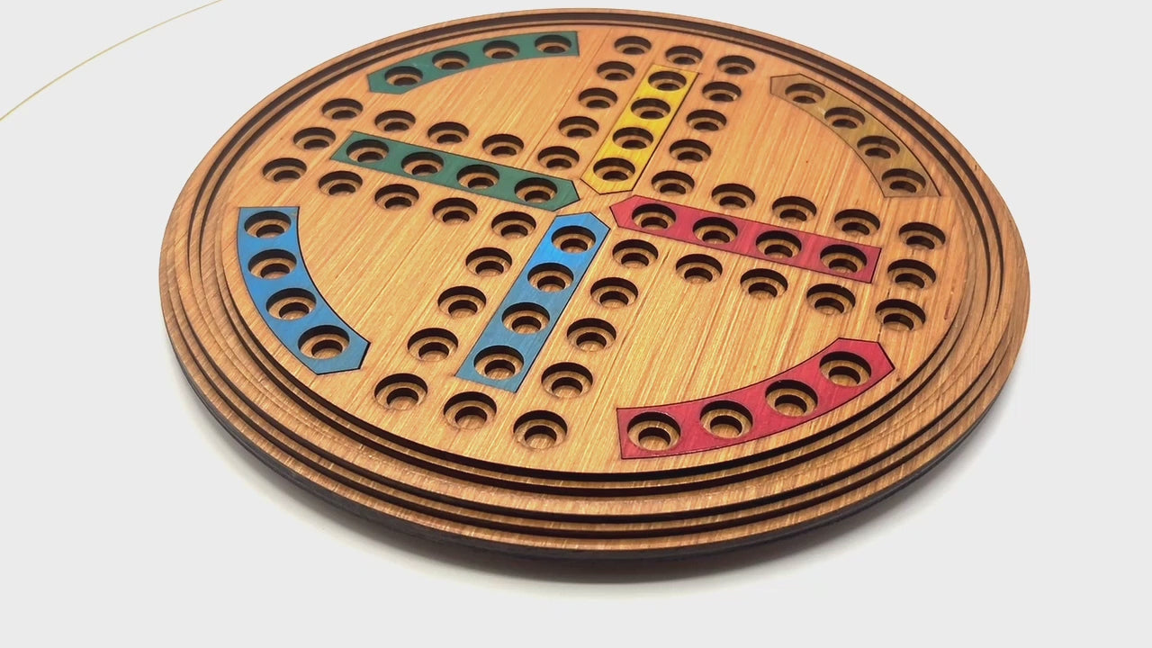 Round Ludo wooden board game with marble pieces