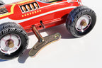 Close up of Red Race Car number 12 tin toy with wind up key