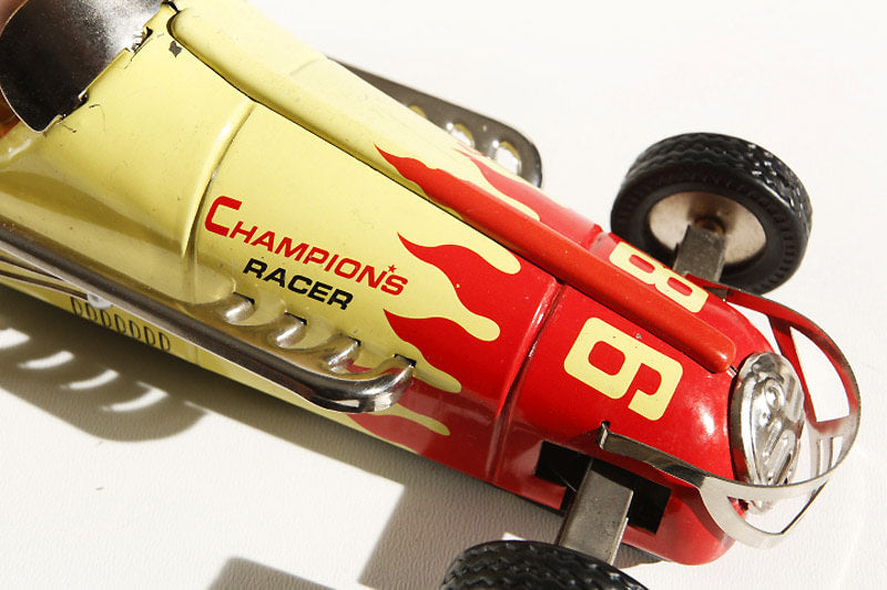 Close up of Champion racer car 98 Tin Toy
