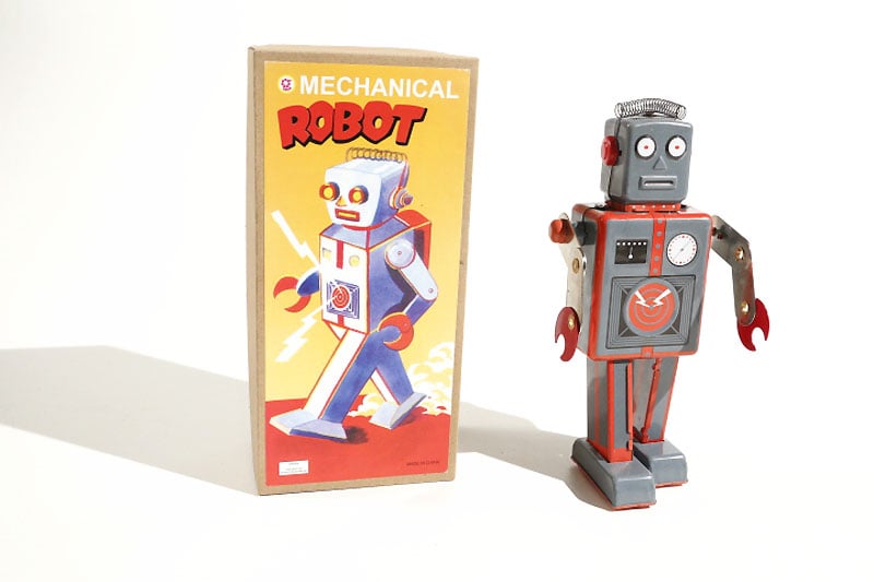 Radicon Mechanical robot tin toy next to its packaging 