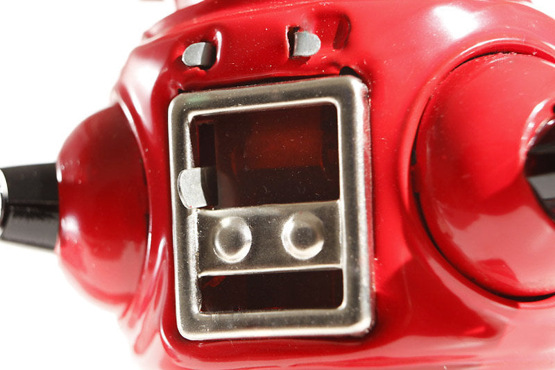 Close up of red sparking Vintage robot tin toy 