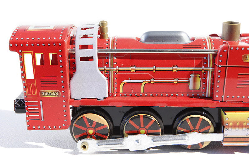 Close up of Red Wind-Up Locomotive tin toy