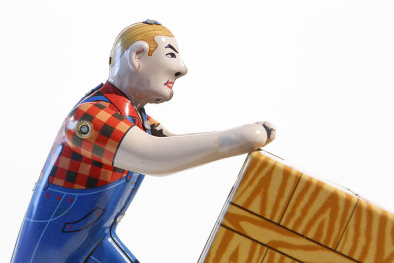 Close up of Removal man and box tin toy