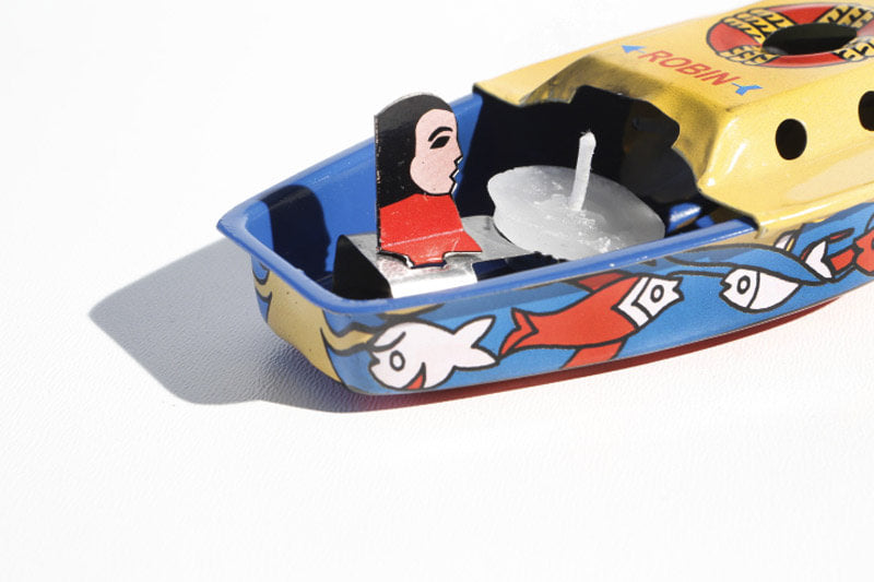 Close up of Robin Pop Pop Boat Tin Toy