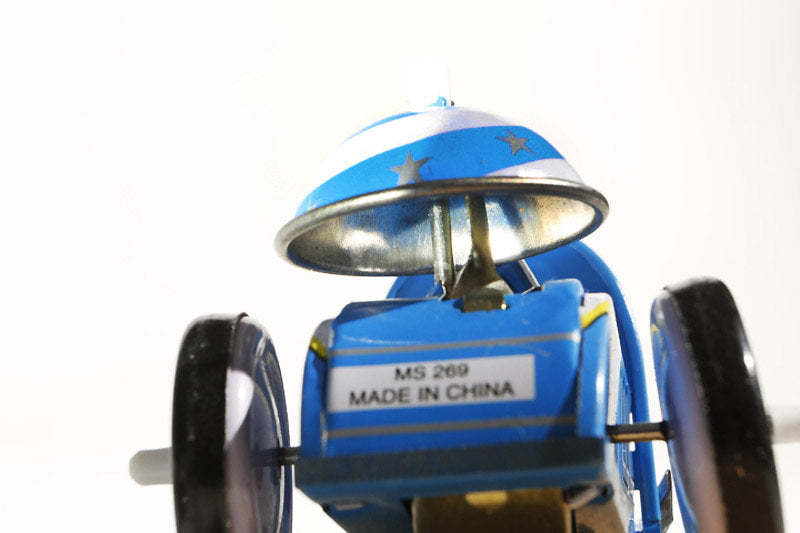 Close up of Robot racer tin toy car 