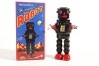 Black Roby Vintage-style robot tin toy  next to its packaging