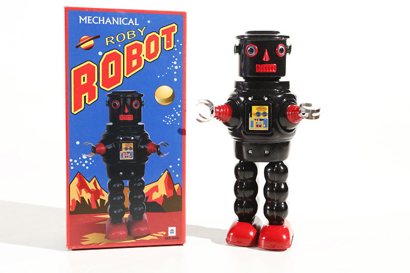 Black Roby Vintage-style robot tin toy  next to its packaging