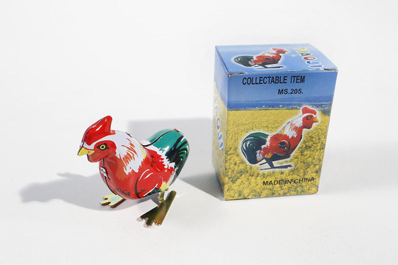 Rooster tin toy with its packaging