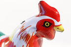 Close up of rooster head tin toy