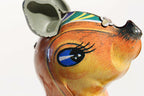 Close up of kangaroo with baby  face tin toy