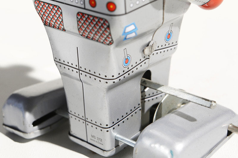 Close-up of  Rosie Tin Toy Vintage-style tin toy robot 