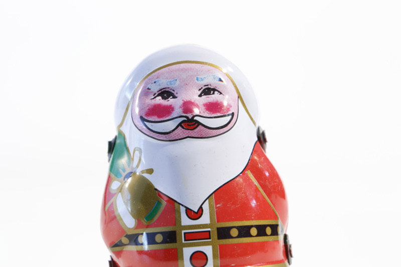Close up of Tin Santa tin toy