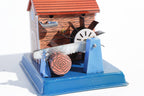Close up of Saw-mill log cutter tin toy