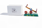 Seesaw tin toy with packaging