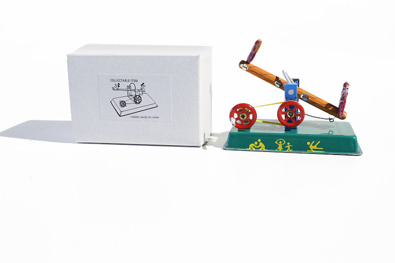 Seesaw tin toy with packaging
