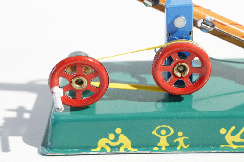 Close up of Seesaw tin toy