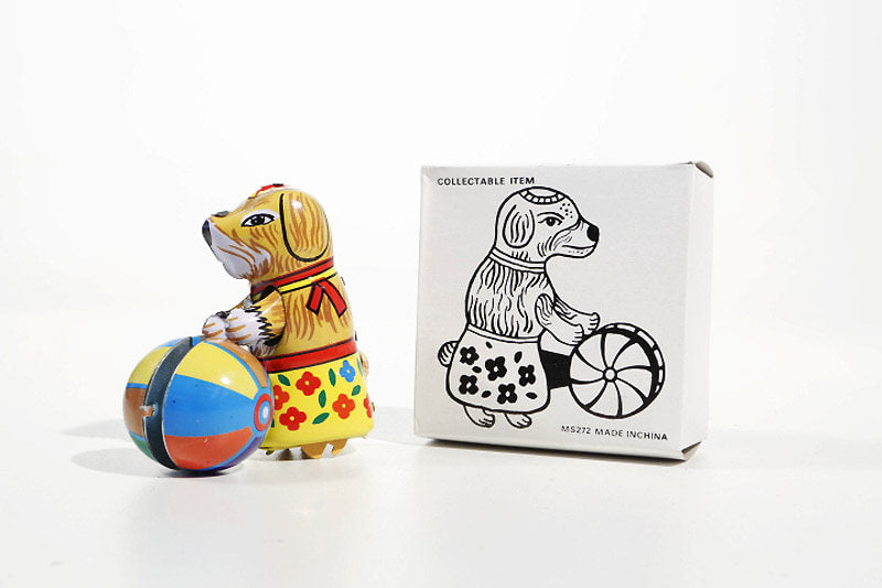 Small dog with Ball tin toy and its packaging