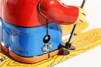 Close up of Small Girl on Ski's tin toy