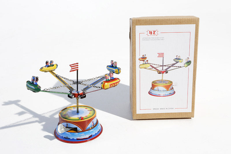 Small Rocket carousel tin toy with packaging