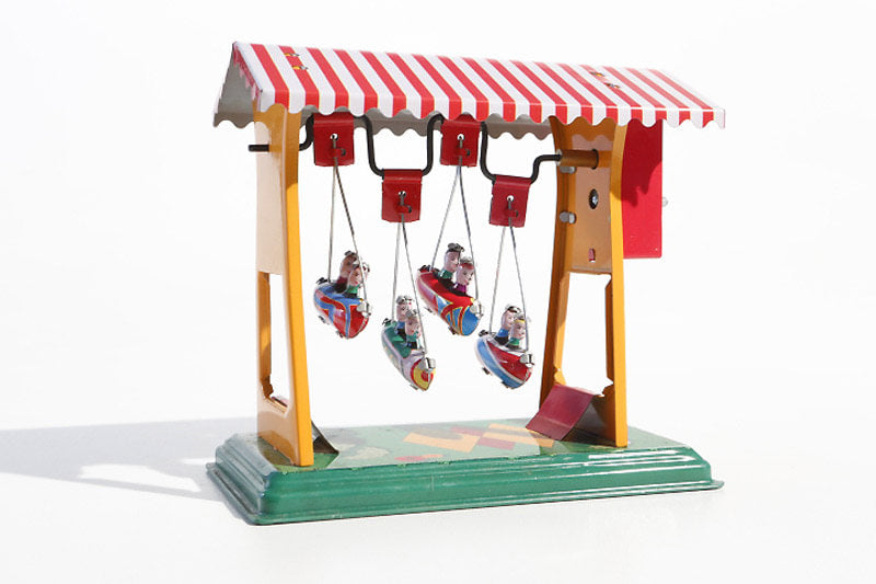 Small swing boats fairground tin toy