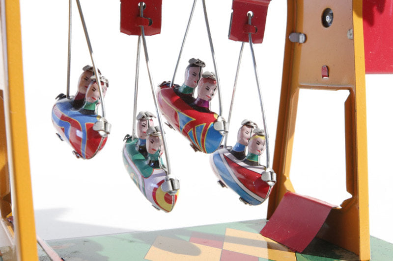 Small swing boats fairground tin toy